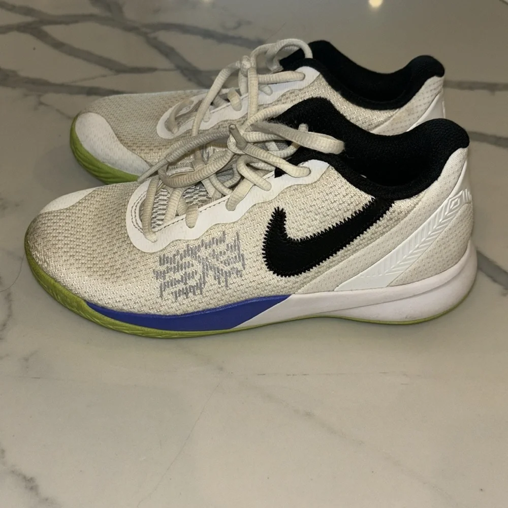 Gently used Nike Kyrie boys sneakers white black lime green and purple size 2.5